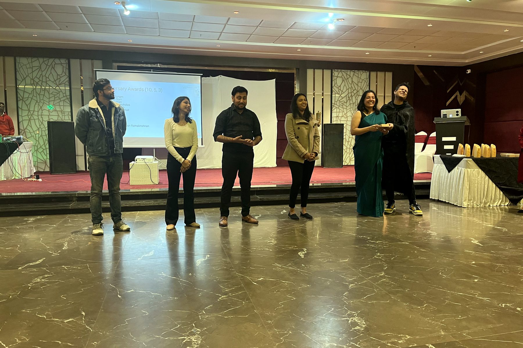 A team presenting their idea on stage at the Ideathon